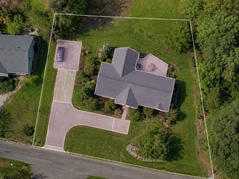 Overhead view of roof, driveway, patio, gravel area, and lawn measured during an impervious-cover survey