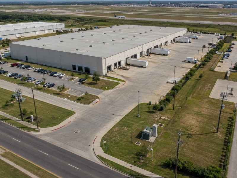 Aerial view of an industrial site for an ALTA survey with buildings parking and access roads in Austin Texas